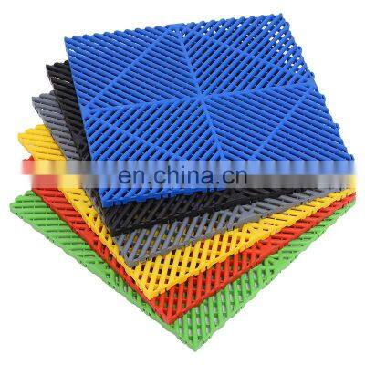 Motofloor modular self draining rigid plastic garage floor tile