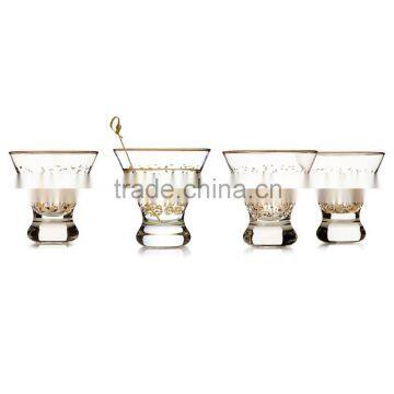 hand blown stemless martini glass with gold rim