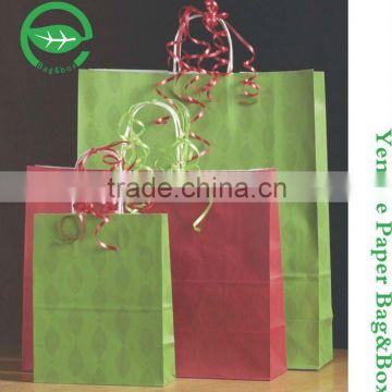 Machine made 100gsm Green color White kraft paper carrier bag for shopping with handle