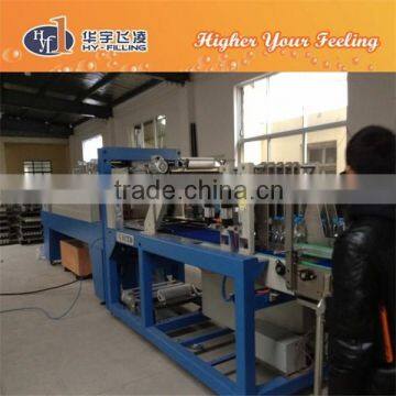 Automatic film wrapping machine for PET bottle