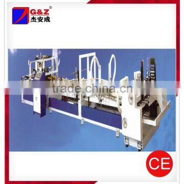 Automatic carton gluing machine