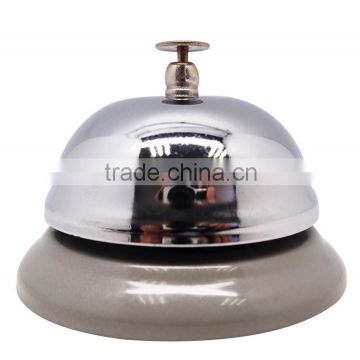 reception bell on table in silver or gold cover and colorful painted base with logo