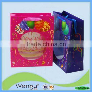 Red and blue matt laminated packaging presents hand paper bag with PVC window