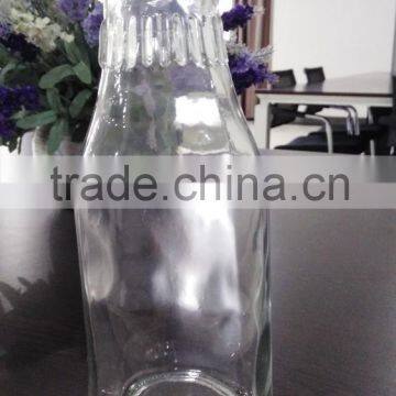 clear milk glass bottle with tin