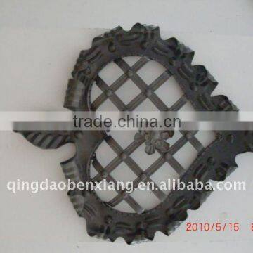 the modern style wrought iron rosettes use to gate and fence