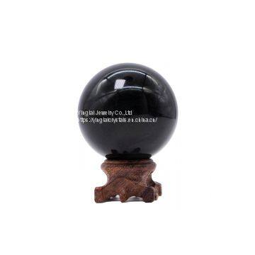 Polished black crystal obsidian sphere ball for healing
