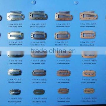 Hair Extension Tools Clips in various sizes used in salon