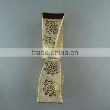 beautiul golden porcelain type vase with flower design