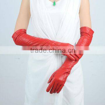 woman putting on long red leather glove in China