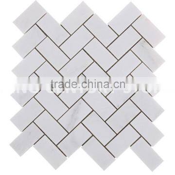 top level herringbone shape bathroom wall tile with white marble