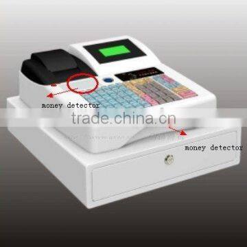 Cash register with money detector