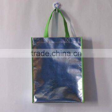 Silver colour laser bag with gree handle