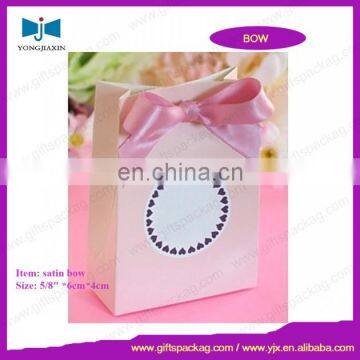 Paper bag with bow tie ribbon