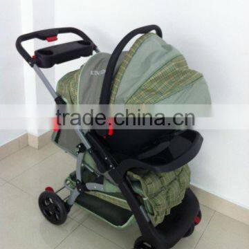 With the children for a walk with baby stroller with carseat the baby carseat