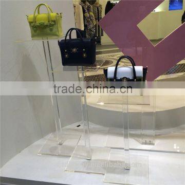 Unique selling point acrylic handbag shoe display riser frame