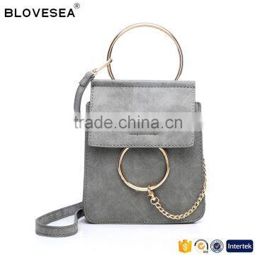 Small trending decorative ring and chain front snap button closure crossbody designer bag