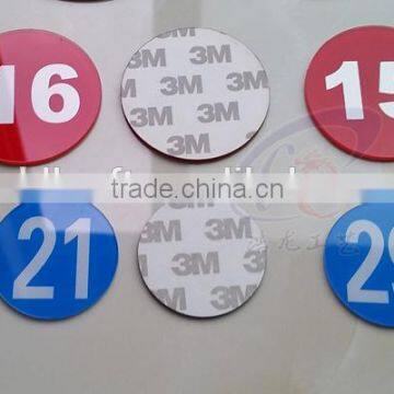 Printed serial numbers on acrylic plate with stickers