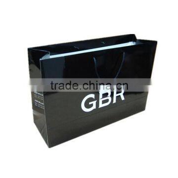 Luxury black paper bag with brand name printed