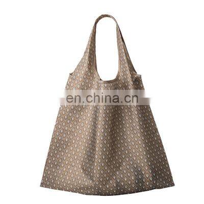 Custom shopping bags roll pp woven bag  portable for women black jacquard pretty fabric non-woven foldable bag