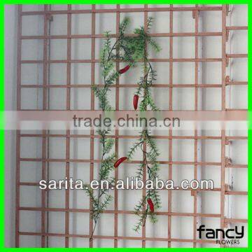 red pepper with artificial hanging vines