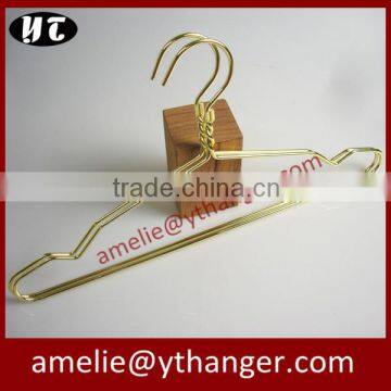 Gold wire coat hangers for luxury garment brand store use