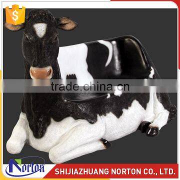 Black and white fiberglass cow seat sculpture for garden NTRS-138LI