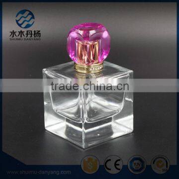 Luxury 100ml clear square glass perfume bottle with decor cap