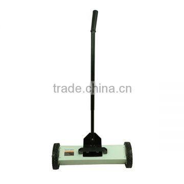 Magnetic road sweeper with handle release