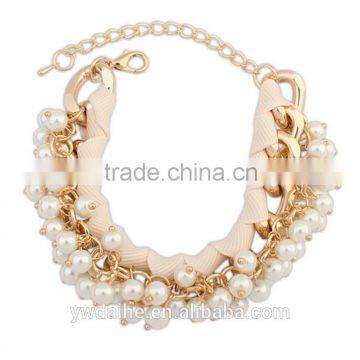 Imitation pearl bracelet with silk ribbon