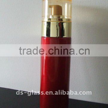 red lotion glass bottle