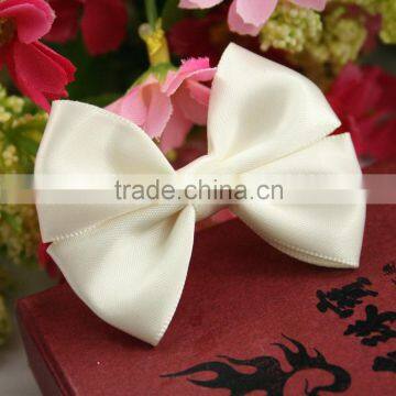 Pre-made white satin ribbon bow for packaging