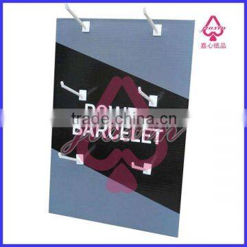 Counter top paper display standee with peg