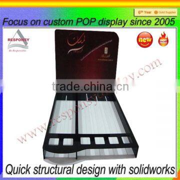 counter display rack made from plexi glass with big graphic communication