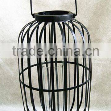 large metal lantern with clear glass cylinder