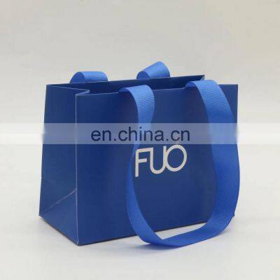 blue shopping gift paper bag in packaging bags