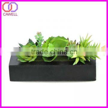 artificial succulent in glass pot