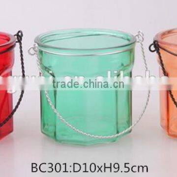 glass candle holder with metal lifting handle and sprayed color