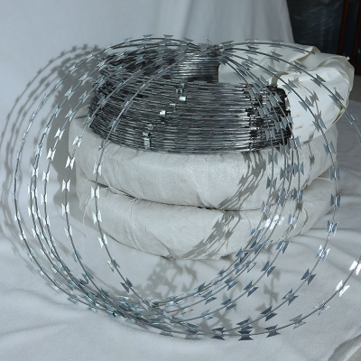 Green Razor-sharp Spiral Barbed Wire, Stainless Steel Coil, for Security Applications.