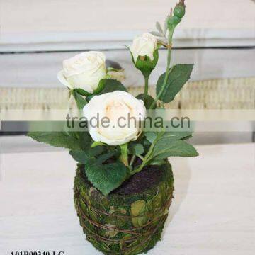 artificial rose in natural pot