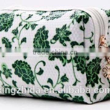 Blue and White Diamond Pattern Cosmetic Bag in Hand photo-2