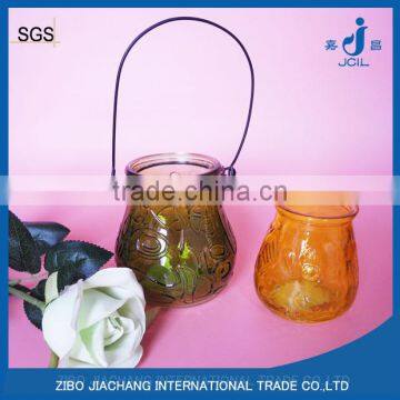 geo cut glass candle jar with metal handle