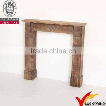 Brown antique wooden fireplace mantel