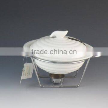 white porcelain casserole with iron rack