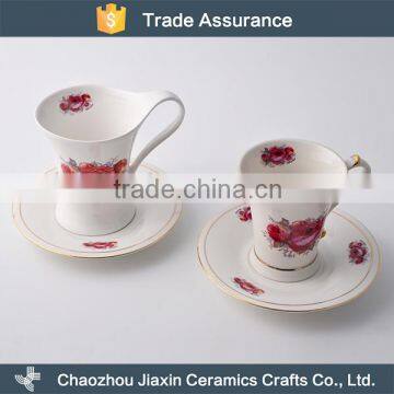 English style flower decal white ceramic red tea cup and saucer                        
                                                                                Supplier's Choice