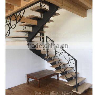 single stringer curved carbon steel wood stair with wrought iron railing