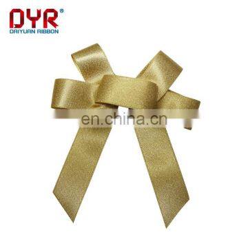 Gold christmas decorative bow for gift package