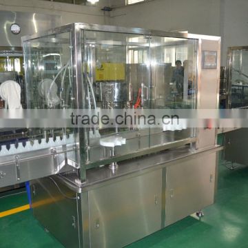 Double headed automatic bottle filling machine