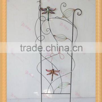 Dragonfly with leaf design wrought iron trellis