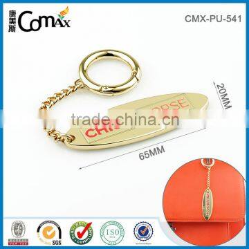 Gold fancy metal oval handbag logo charm