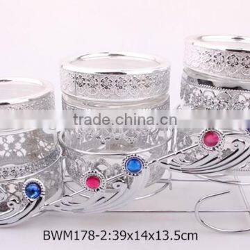 3pcs glass food jar set with metal coating in a silver rack